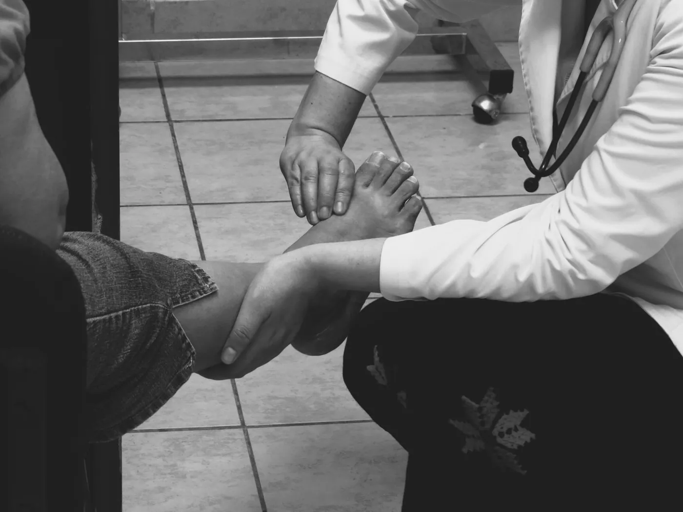 A doctor examining a patient's foot