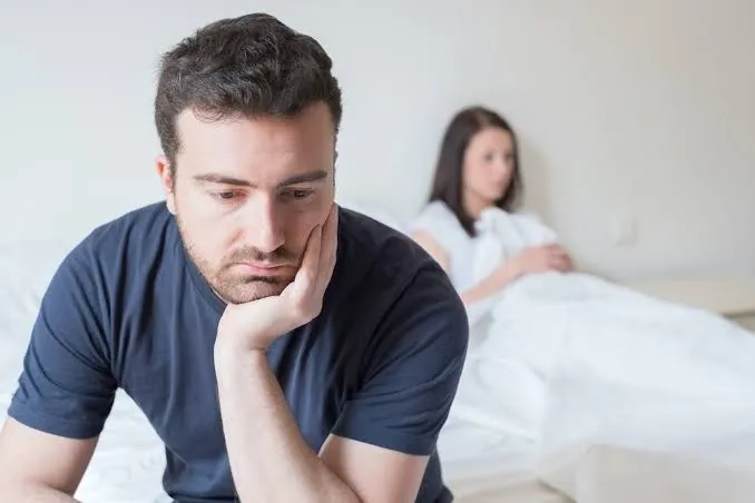 Erectile dysfunction treatment in Lahore: a worried man sitting on the edge of a bed