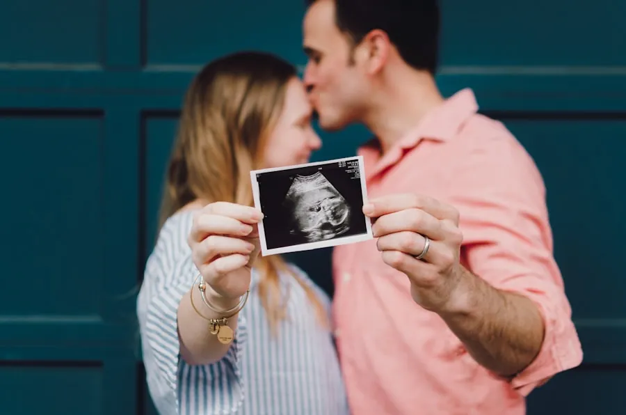 A couple holding up an ultrasound print