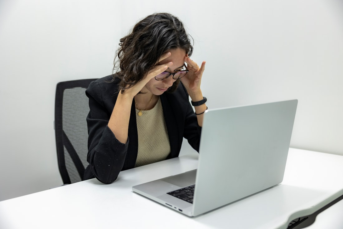 Tired and worried woman experiencing PCOS symptoms such as fatigue and stress - PCOS care in DHA Lahore