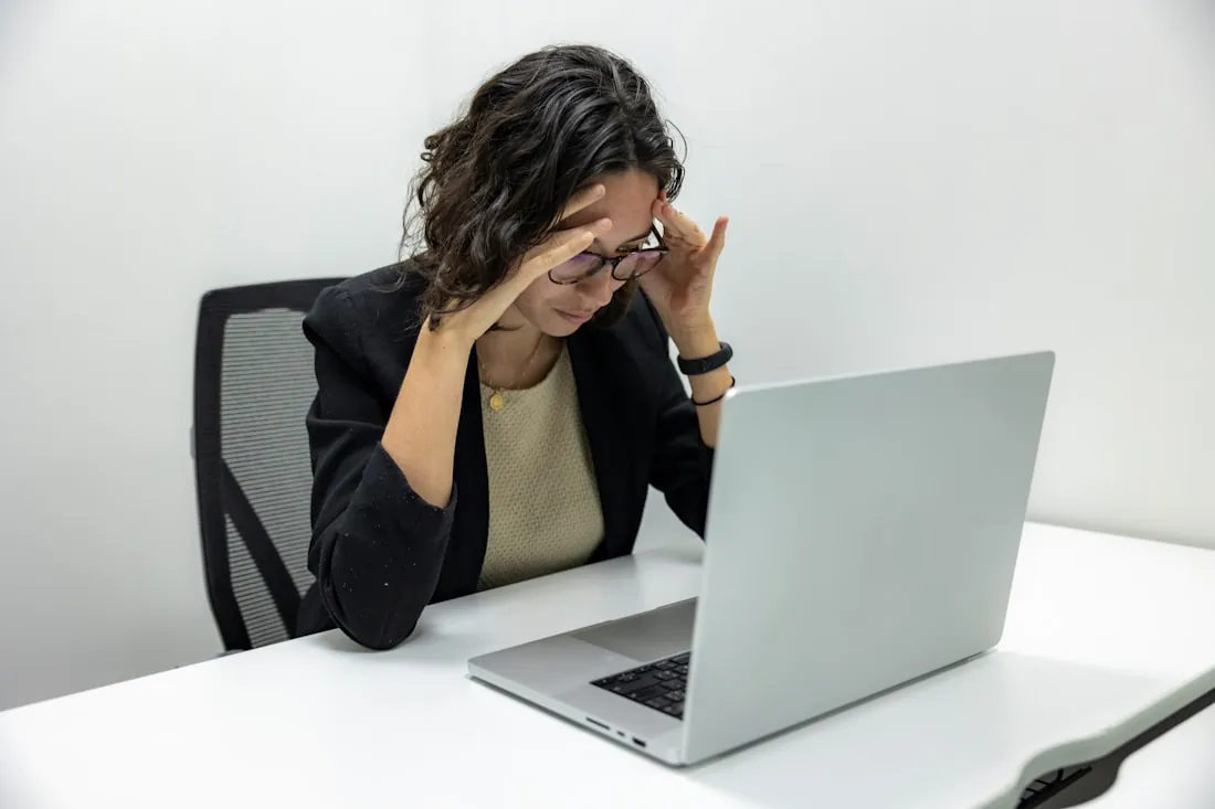 Tired and worried woman experiencing PCOS symptoms such as fatigue and stress - PCOS care in DHA Lahore